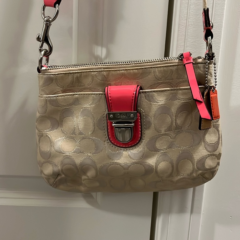 Authentic coach purse, excellent used condition. Cream and hot pink accents